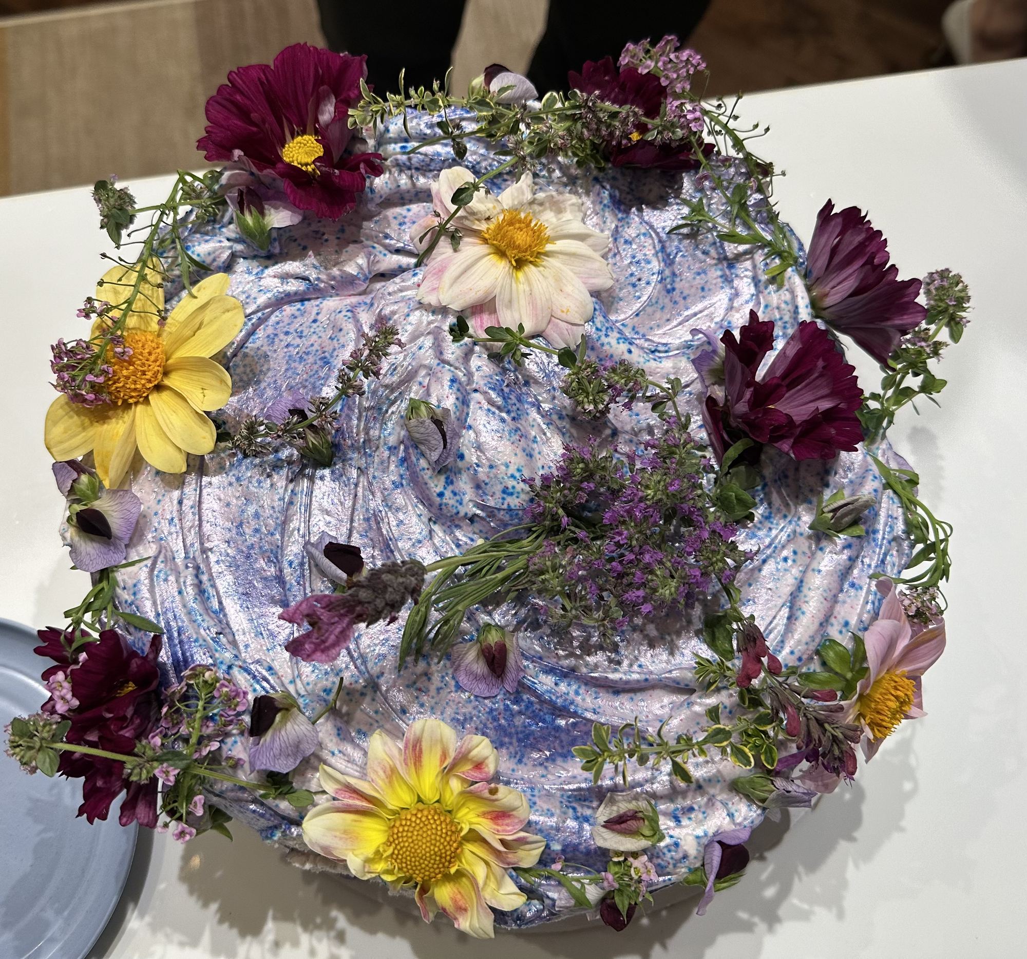 A cake under flowers